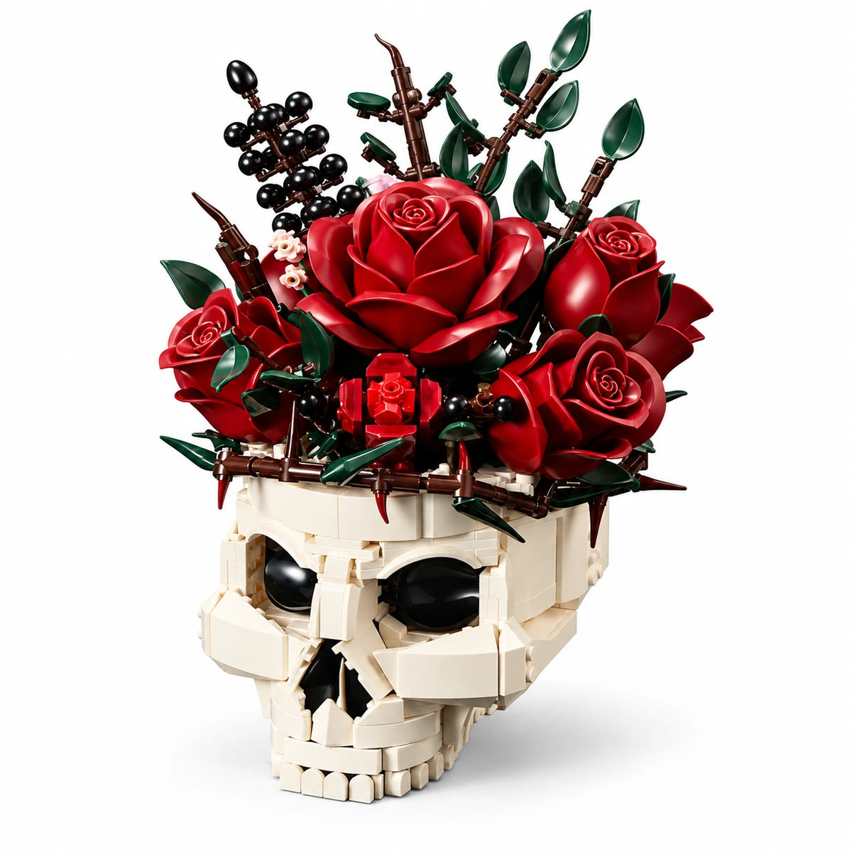 Ivory brick-built skull with red roses, green leaves and black berries